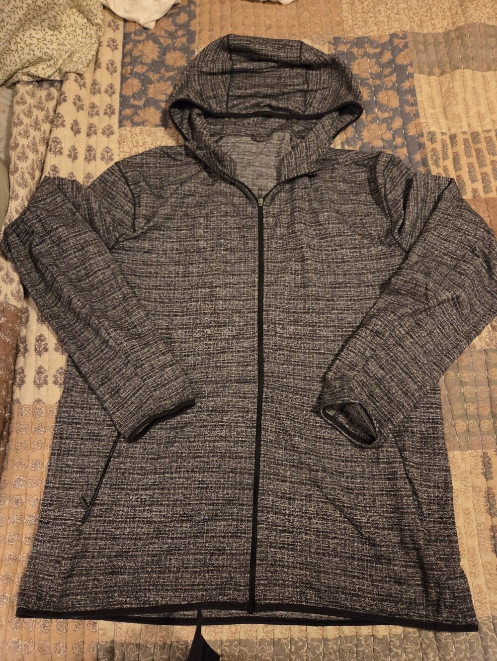 Heathered Gray and Black Lululemon Surge Warm Full Zip.
